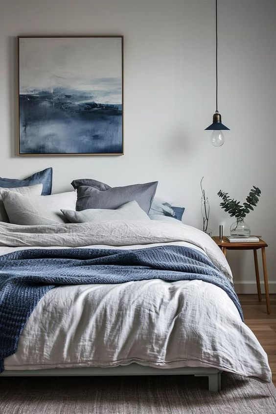 Navy blue and white striped bedroom with a coastal theme
