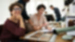 Interior design consulting session in New York with a professional designer reviewing design plans