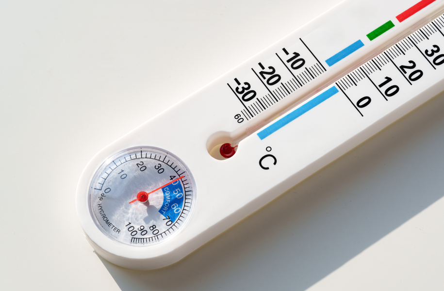 Thermometer with Celsius scale from -30 to 50 and hygrometer showing red needles. White background, colorful scale accents.