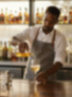 Bartender pouring wine stock image