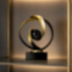 Modern abstract black and gold resin sculpture ornament with sphere for hotel and living spaces