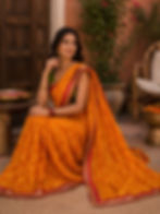 Woman in a red Chunari cotton malmal saree with motif design