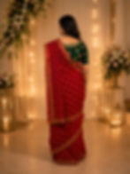 Woman in red Chunari cotton malmal saree, back view