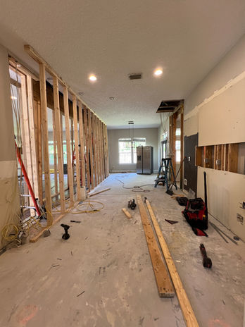 Kitchen in Jacksonville during renovation. Outdated cabinets and style.