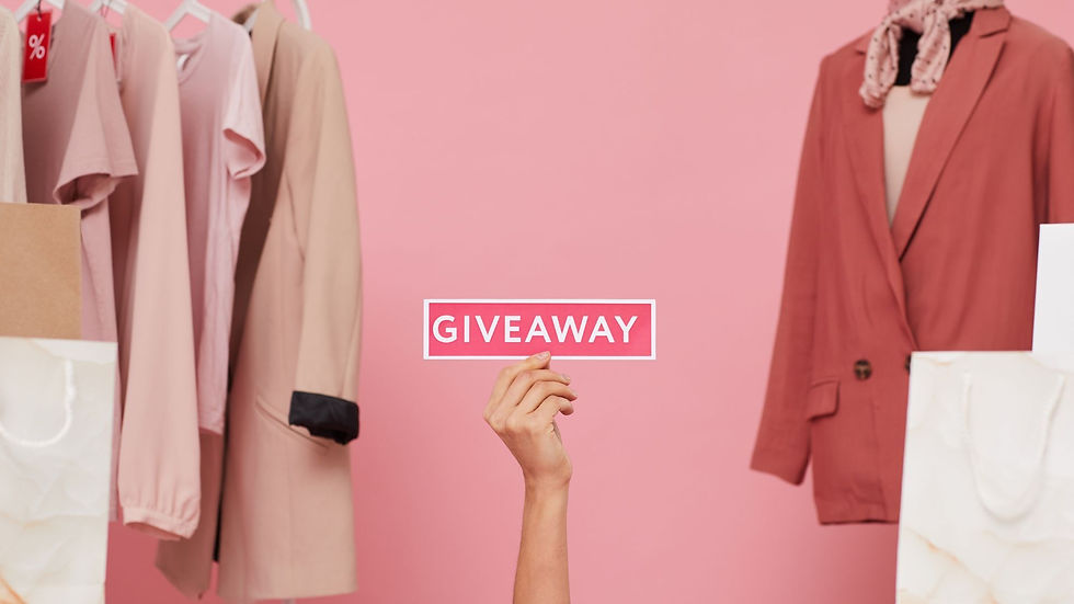 pink background and cloths and woman hand with a giveaway announcement
