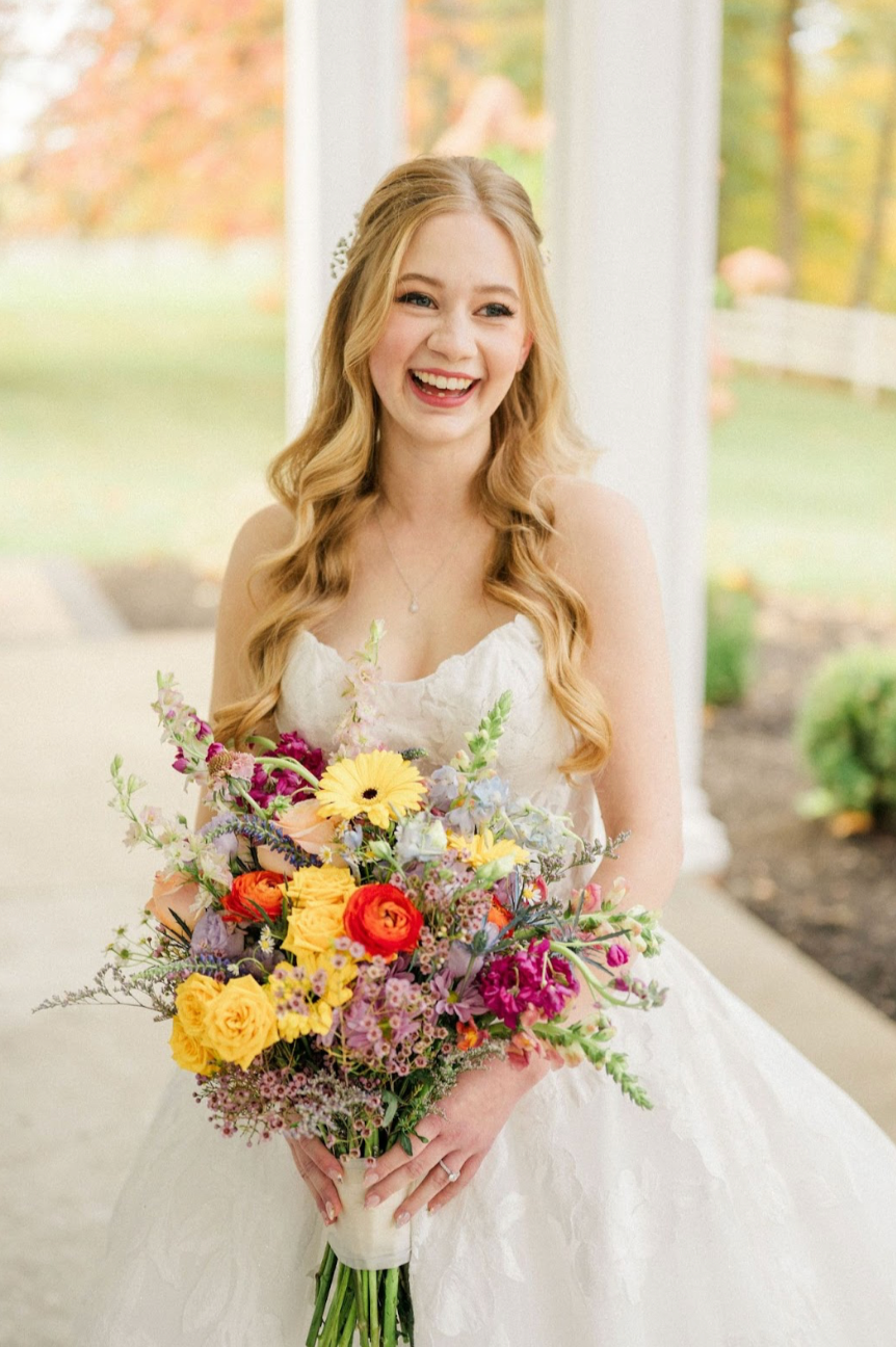 Elegant fall wedding on October 25, 2025 at The Ashland Estate in Ohio featuring golden autumn foliage, a romantic outdoor ceremony, timeless bridal hair and makeup, and a candlelit reception inside the historic estate.