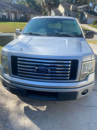 Before Wash & Wax – Ford F-150 covered in dirt and grime, with dull paint and a cloudy windshield, needing professional auto detailing to restore its shine.