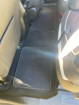 After image of the back seat in a Dark Blue GMC Acadia, showing a completely cleaned, restored, and freshened seat area.