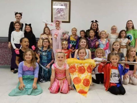 WE Academy dancers in Halloween costumes