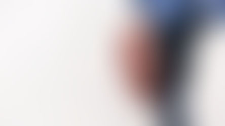 A man holding a brown leather bag