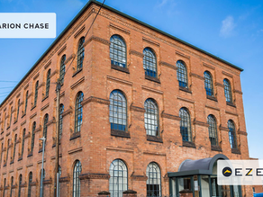 Brick office building with Clarion Chase and Ezekia logos