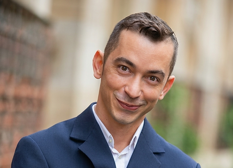 Leandro Lopes de Fretas, Customer Relationship Manager, wearing a blue suit.