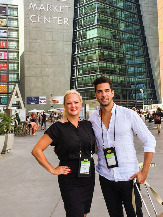 Emily Cameron with a colleague outside a home decor market building