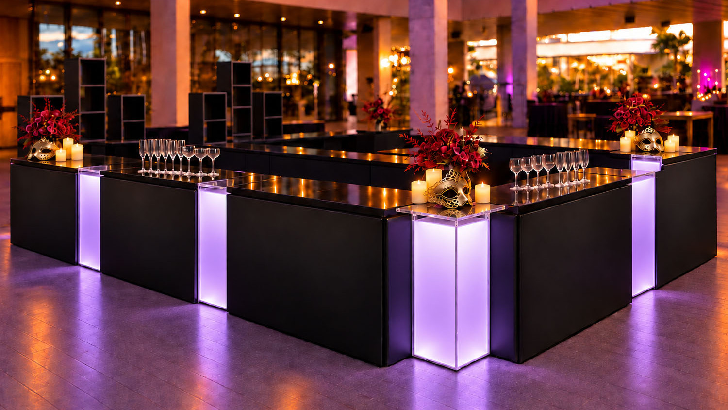 Wide-angle view of an elegant Halloween bar with black candles and amber glassware.