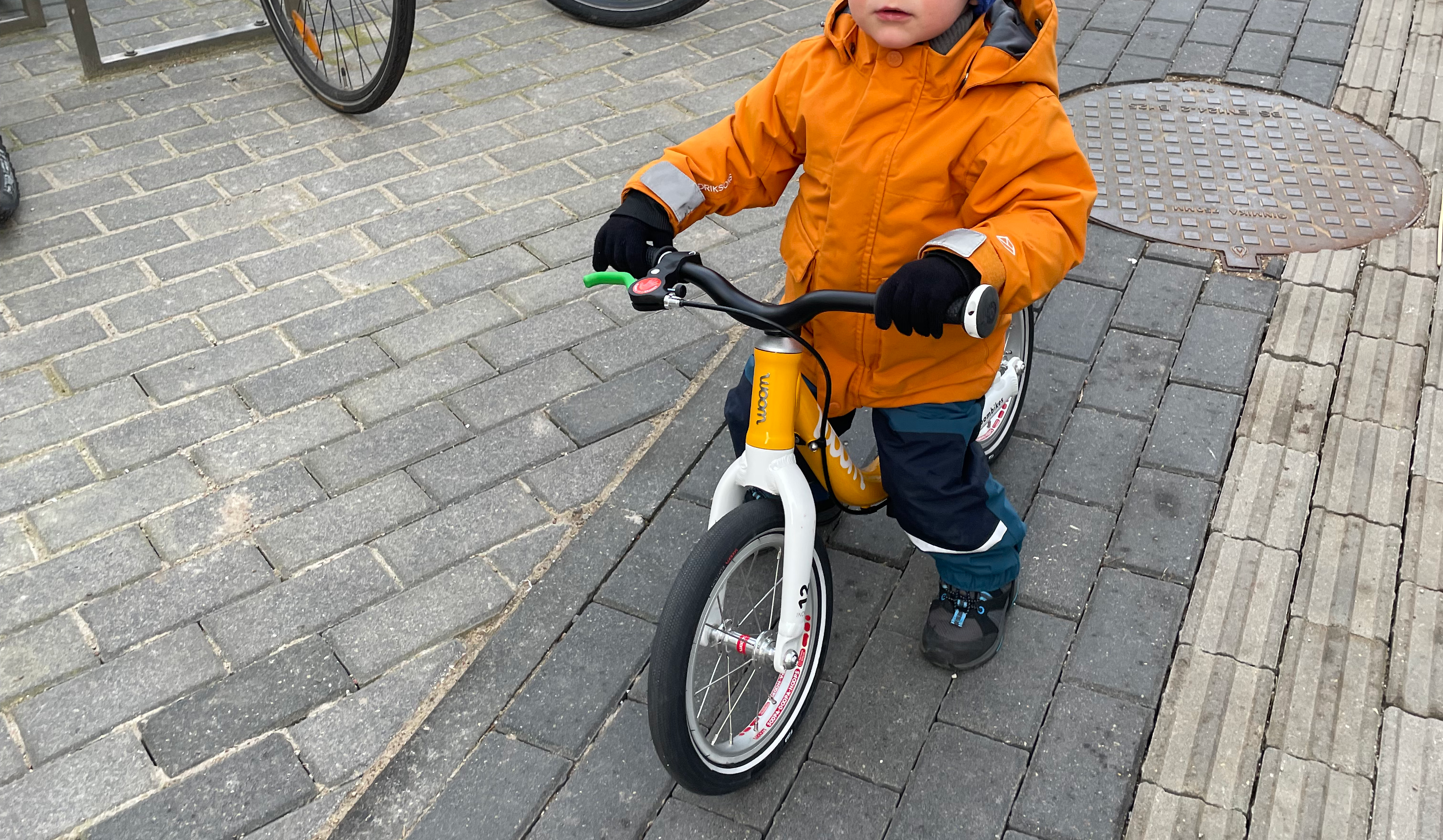 Toddler riding Woom GO 1