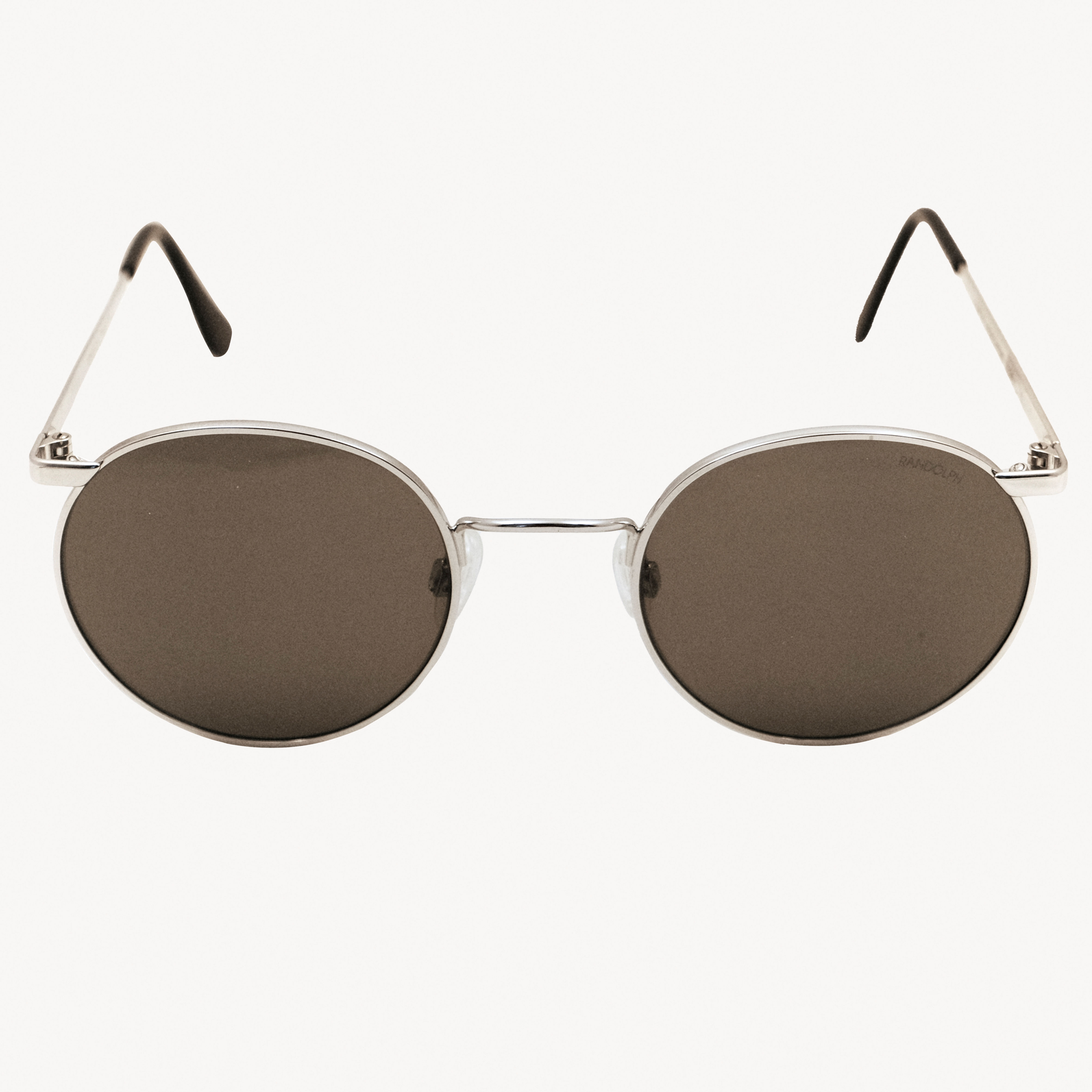 Silver oval sunglasses with dark brown lenses