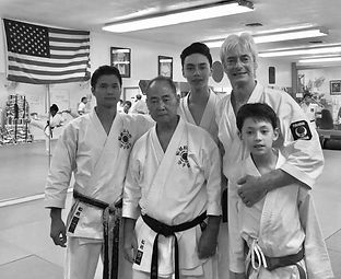 Laurence Brahm with Shihon Kenneth Funakoshi together with his son Kyle Funakoshi and his