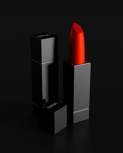 Black lipstick tube with red lipstick bullet against a black background