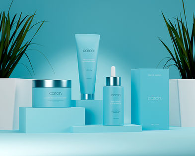 Blue skincare collection displayed with plants and geometric blocks