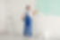 Man painting wall with light blue dye indoors.jpg