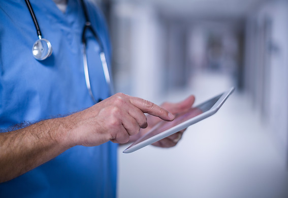 male-surgeon-using-digital-tablet-operation-room.jpg