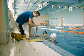 two-schoolgirl-water-polo-players-listening-teacher-poolside-have-fun-play-splash-blue-swi