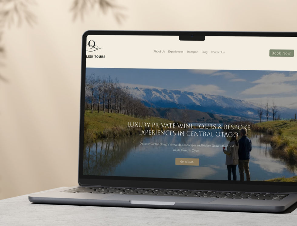 Laptop displaying a travel website with mountain and lake scenery. Text reads "Luxury Private Wine Tours & Bespoke Experiences in Central Otago."