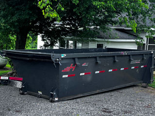 Empty dumpster waiting for kitchen remodel debris.