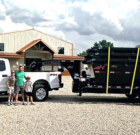 Roll-off dumpster rental in Lebanon TN being transported by a Five Brothers Dumpsters truck.