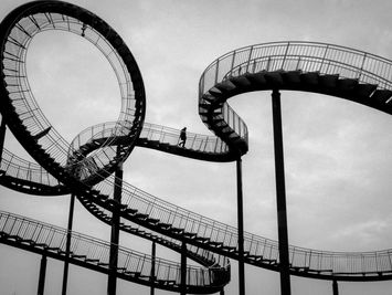 Diagram showing potential energy converting into kinetic energy as a roller coaster moves.