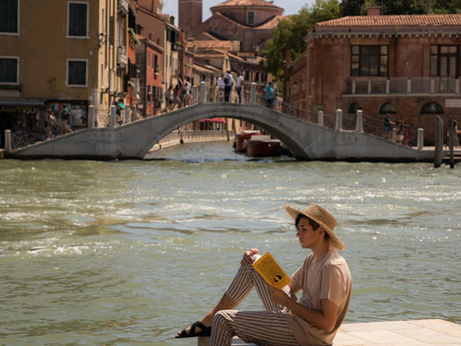 A traveller enjoying a quiet view of an Italian city .