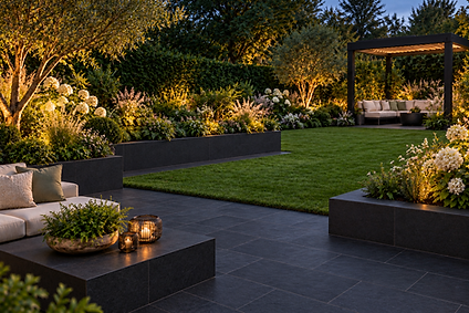 Evening garden design and Landscaping with black slate paving and raised beds, white hydrangeas, a lawn and an illuminated pergola seating area.