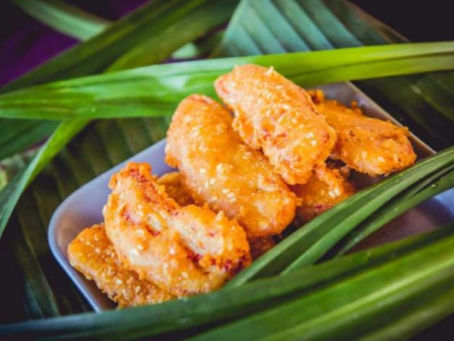 Golden crispy deep-fried Thai bananas with coconut and sesame