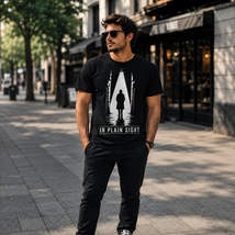 Silhouette of detective under streetlight in alley with In Plain Sight text. Film noir style t-shirt design