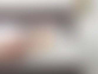 A cartoon overlay of a large bed bug on a mattress under a hand-held magnifying glass showing how important inspection is to professional pest control services, like those done by Home Guard IPM.