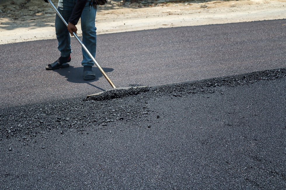 Paving crew laying new asphalt on a commercial lot in Columbus, Ohio