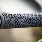 Close-up of the textured handlebar grip and Supersmith logo on a 3Scooter.