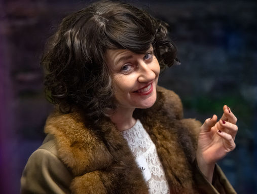 Smiling guest in 1920s-style costume at a New Year’s Eve event in Bristol.