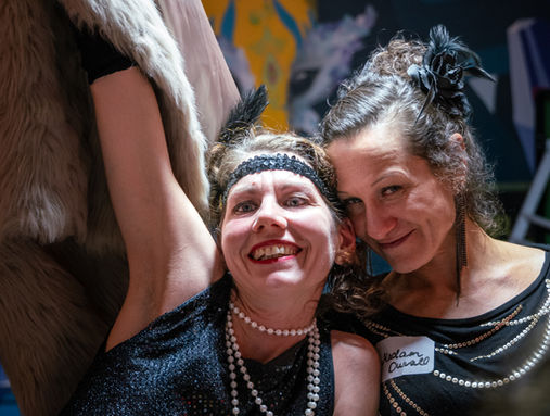Two guests in 1920s-style costume posing together at a New Year’s Eve event in Bristol.