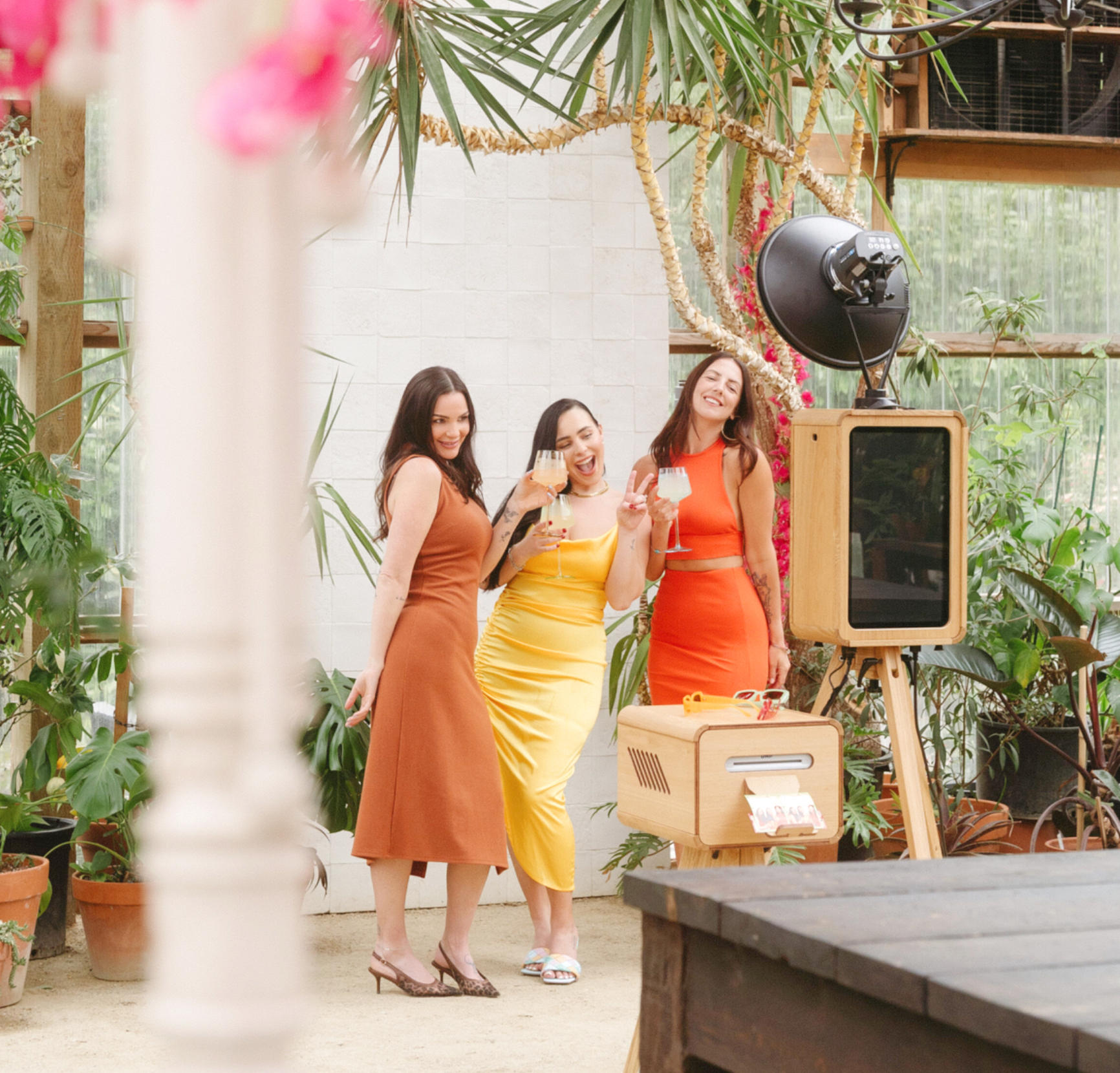 Open air vintage photo booth with editorial styling and printed keepsakes