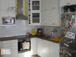 erezett fehér vákumfóliás L alakú konyha