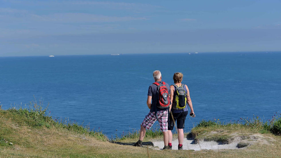 Walkers enjoying the scenic splendour of the white cliffs of Dover