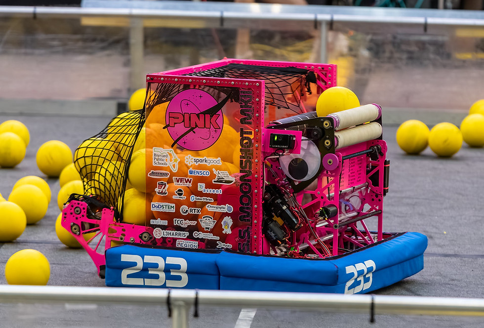 Pink Team 233 Moonshot robot collecting yellow balls