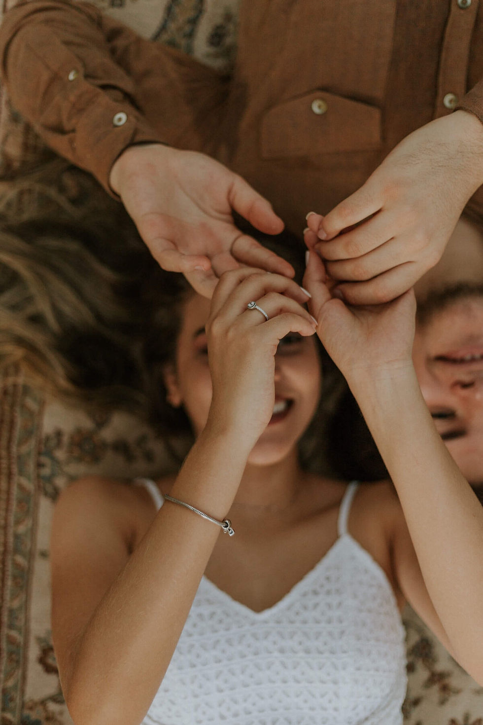 Happy couple holding hands, playful moment