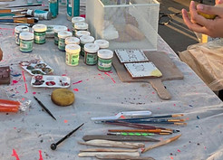 Materials for painting pottery are on a 