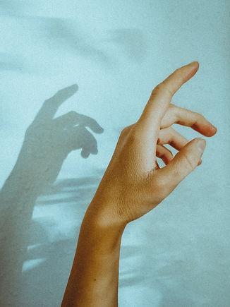 persons left hand on white textile_edited.jpg