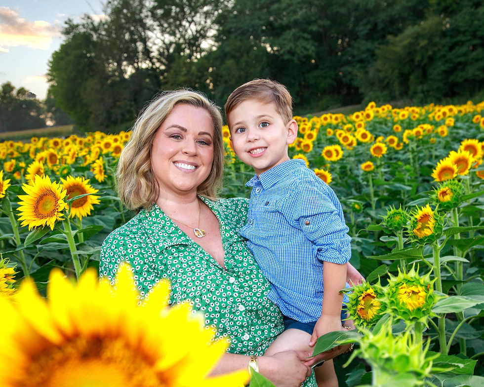 Mom and child in sunflower field for outdoor mini session photoshoot near Overland Park KS