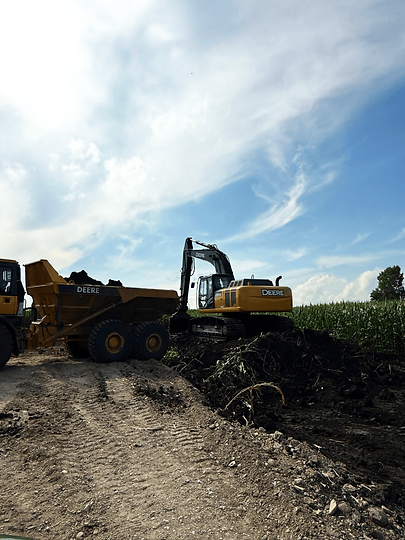 Heavy duty equipment being used to work the land.