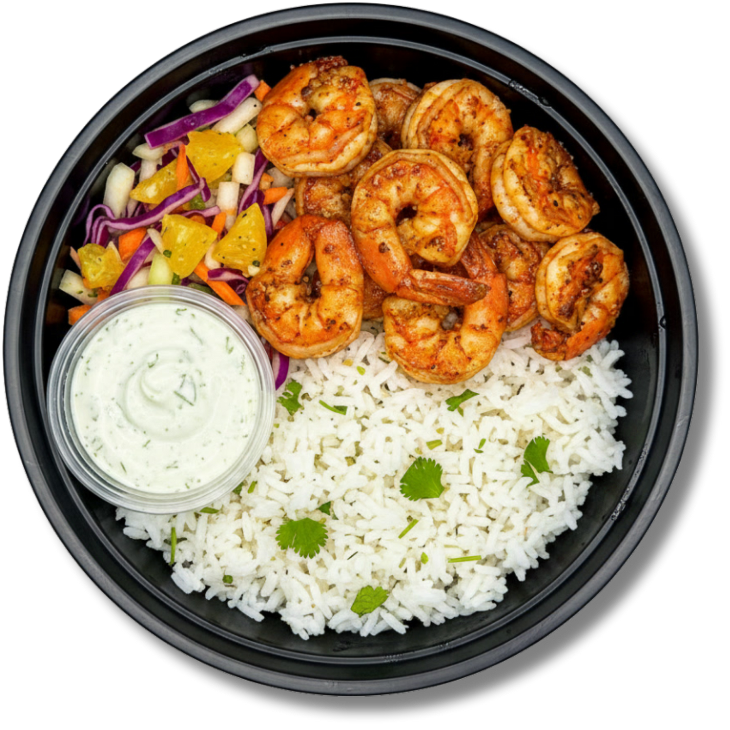 The LunaFit Fresh Smoky Shrimp Bowl Meal sits in a round black bowl filled with smoky, reddish-orange seasoned grilled shrimp over white rice, garnished with diced yellow and red peppers, and served with a small cup of creamy white dressing.