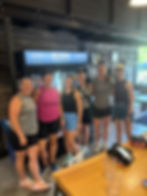 runners smiling inside brewery